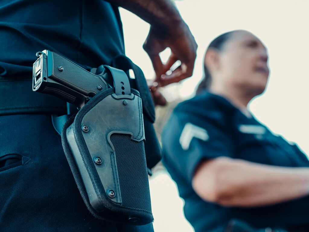 Police officers with piston holsters
